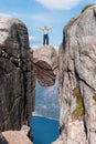 Portrait of a extreme plan travel for the handsome old man on the stone of the kjerag in the mountains of Norway, s