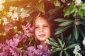 portrait face of candid beautiful little kid girl of eight years old with brown eyes on