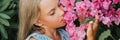 portrait face of candid little kid girl of eight years old on background of green plants and