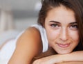 Portrait, face and woman with smile in bedroom, wellness and wake up from healthy sleep on bed. Morning, girl and female Royalty Free Stock Photo