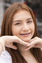 Portrait of face young caucasian beautiful woman blond hair smiling with braces. Happy girl in good mood smile showing teeth Royalty Free Stock Photo