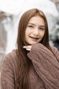Portrait of face young female caucasian beautiful sweaters woman blond hair smiling with braces. Happy girl in good mood smile Royalty Free Stock Photo