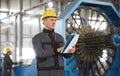 Portrait of factory worker holding paper clipboard Royalty Free Stock Photo