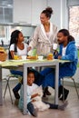Portrait of a family breakfast together in the kitchen Royalty Free Stock Photo