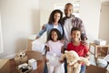 Portrait Of Family Carrying Boxes Into New Home On Moving Day Royalty Free Stock Photo