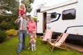 Portrait Of Family Enjoying Camping Holiday In Camper Van Royalty Free Stock Photo