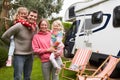 Portrait Of Family Enjoying Camping Holiday In Camper Van Royalty Free Stock Photo