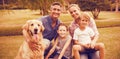 Portrait of family enjoying with dog at park Royalty Free Stock Photo