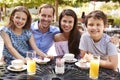 Portrait Of Family Enjoying Snack At Outdoor CafÃ¯Â¿Â½ Together Royalty Free Stock Photo