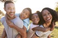 Portrait Of Family Enjoying Walk In Park Together Royalty Free Stock Photo