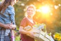 Portrait of a family of famers carrying their vegetables home in wooden boxes, at the end of the day, the Father is carrying their Royalty Free Stock Photo