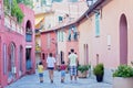 Portrait of family of four, walking on the streets of Villefranche, France