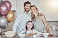 Portrait, family or girl in celebration of a happy birthday in a house party or kitchen with a smile popcorn or cake