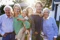 Portrait Of Family With Grandparents Standing Outside House Royalty Free Stock Photo