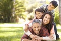 Portrait Of Family Lying On Grass In Countryside Royalty Free Stock Photo