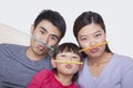 Portrait of family making a face with drinking straws