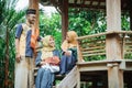 family muslim sitting in the garden and having a conversation