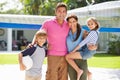 Portrait Of Family Playing Volleyball In Garden At Home Royalty Free Stock Photo