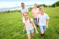 Portrait of family running in fields Royalty Free Stock Photo