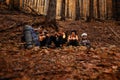 Portrait of a family sitting down to rest during a hike in the mountains. Royalty Free Stock Photo