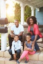 Portrait Of Family Sitting Outside House Royalty Free Stock Photo