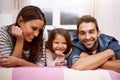 Portrait, family or smile in bed to relax, love or trust in diversity, bonding or together in house. Papa, mama or girl