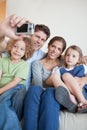 Portrait of a family taking a photo of themselves Royalty Free Stock Photo