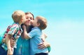 Portrait family two children sons kissing mom, mother`s day Royalty Free Stock Photo