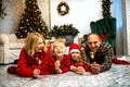 Portrait of a family with two children using sparklers at home on Christmas. Royalty Free Stock Photo