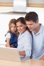 Portrait of a family using a laptop Royalty Free Stock Photo