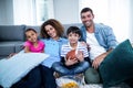 Portrait of family watching american football match on television Royalty Free Stock Photo