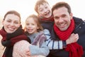 Portrait Of Family On Winter Beach