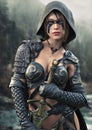 Portrait of a fantasy female Ranger pathfinder with tribal face paint wearing leather armor Royalty Free Stock Photo