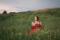 Fantasy princess sitting on the hill in the grass Royalty Free Stock Photo