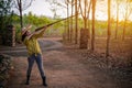 Portrait the farmer asea woman wearing a hat at the shooting range shot from a muzzle-loading vintage gun in the farm, Young girl Royalty Free Stock Photo