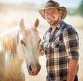 Portrait, farmer and man with horse, cowboy and sunshine with environment, happiness and smile. Summer, person and