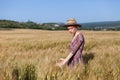 Portrait of a farmer woman in a dress in a field of rye harvest Royalty Free Stock Photo