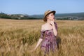 Portrait of a farmer woman in a dress in a field of rye harvest Royalty Free Stock Photo