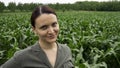 Portrait of farmer woman in field of corn