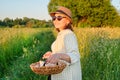 Portrait of farmer woman in hat with basket of fresh egg Royalty Free Stock Photo