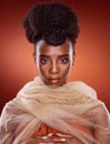 Portrait, fashion and black woman with beauty, stylish and confident lady against a red studio background. Face, female Royalty Free Stock Photo