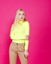 Portrait of fashion blonde model girl young woman wearing stylish isolated on a pink