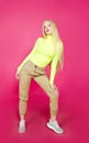 Portrait of fashion blonde model girl young woman wearing stylish isolated on a pink
