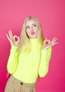 Portrait of fashion blonde model girl young woman wearing stylish isolated on a pink