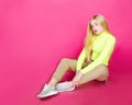 Portrait of fashion blonde model girl young woman wearing stylish isolated on a pink