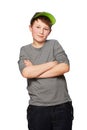 Portrait, fashion and a boy child arms crossed in studio isolated on a white background for youth style. Smile, trendy