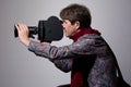 Portrait of a fashion cameraman with old movie camera Royalty Free Stock Photo