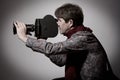 Portrait of a fashion cameraman with old movie camera Royalty Free Stock Photo