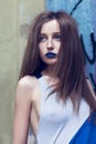 Portrait of fashion lady with blue lips and long hair Royalty Free Stock Photo