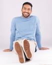 Portrait, fashion and man smile on the floor in studio isolated on a white background. Style, happy and Asian person Royalty Free Stock Photo